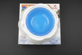 Collapsible silicone pet bowl with blue interior on a white background